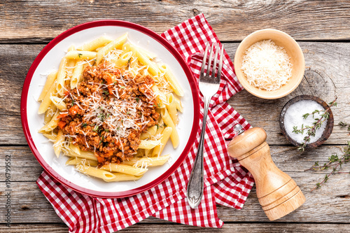 Pasta bolognese. Macaroni served with a classic italian bolognese stew sprinkled with Parmesan cheese photo