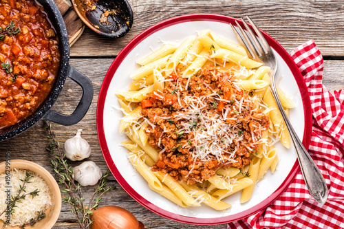 Pasta bolognese. Macaroni served with a classic italian bolognese stew sprinkled with Parmesan cheese photo