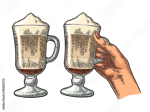 Glass of Latte macchiato coffee with whipped cream.