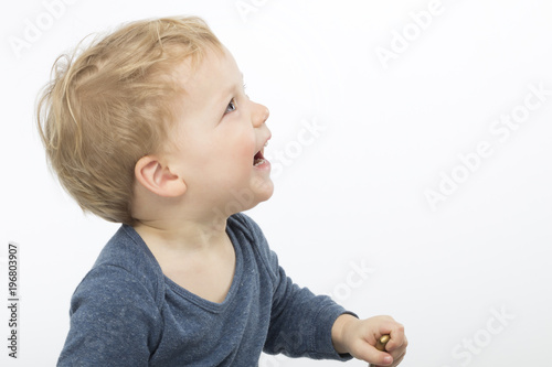 laughing cute toddler isolated on white background. copy space
