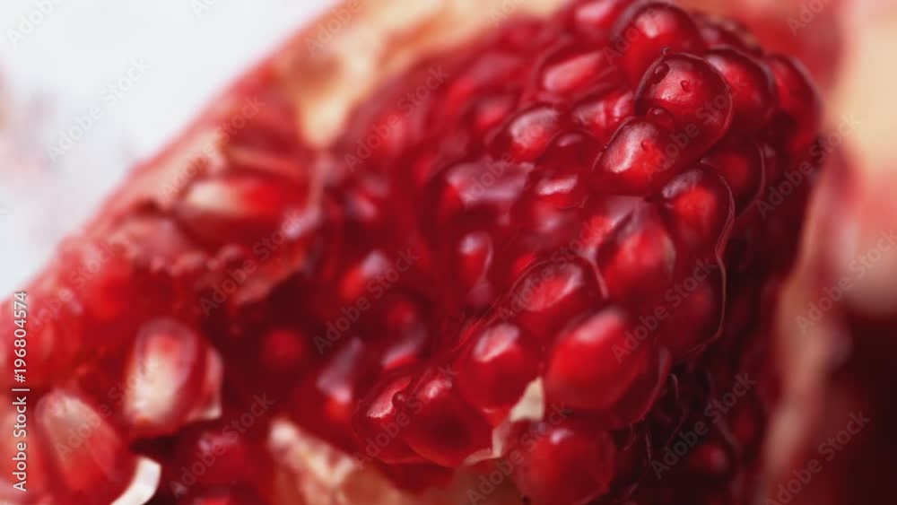 Water splash on open pomegranate. Shot with high speed camera, phantom flex 4K. Slow Motion.