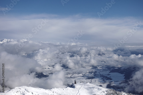 View above clouds on a mountain peak