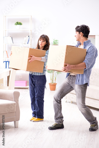 Young family moving in to new apartment after paying off mortgag