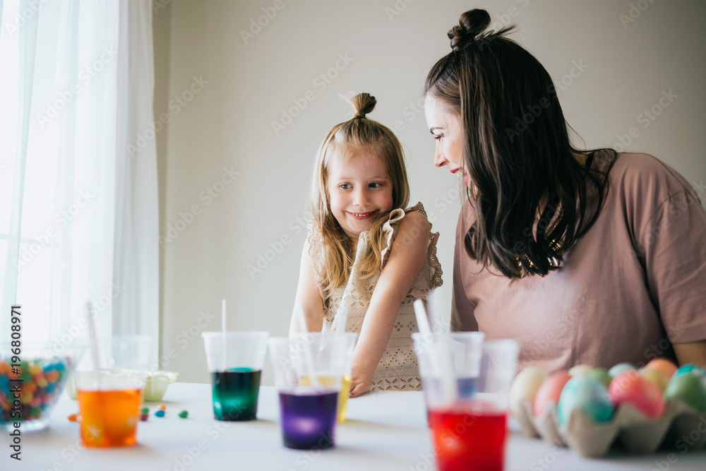 Mother and Daughter Painting Easter Eggs together Mother and Daughter Painting Easter Eggs together