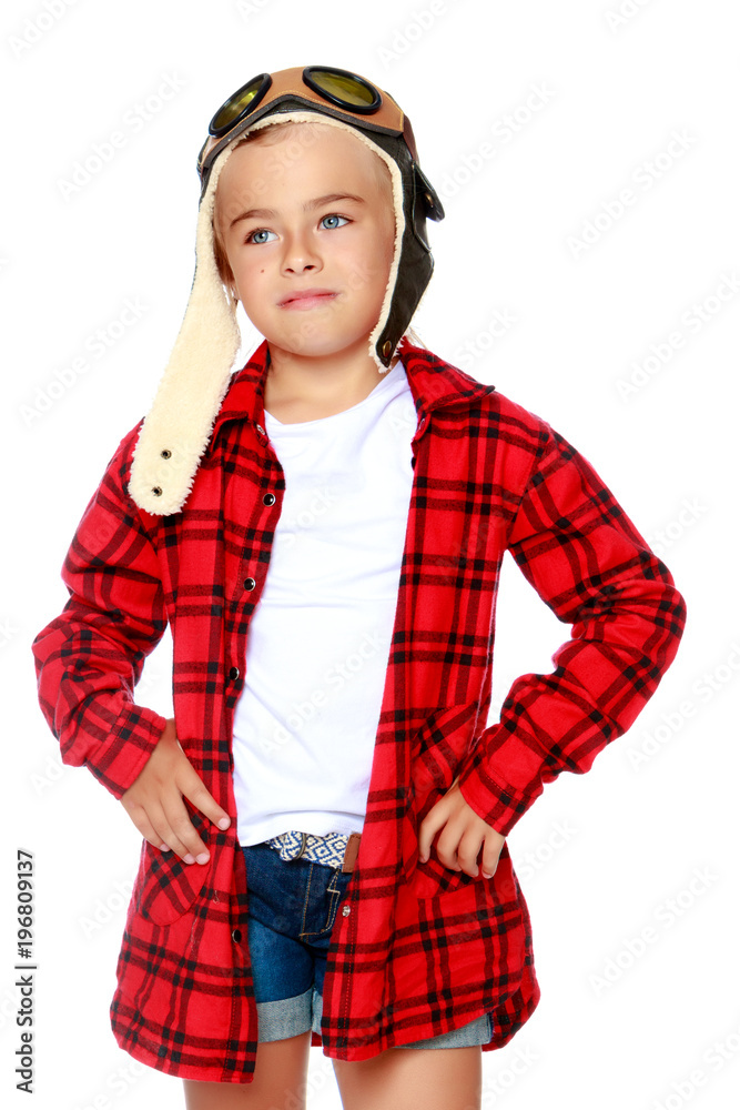 Little girl with a wooden plane in her hand. Little girl with a wooden plane in her hand.