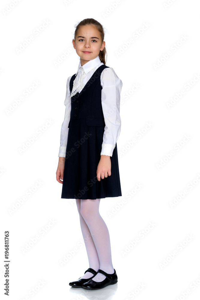 Beautiful little girl in a school uniform. Beautiful little girl in a school uniform.
