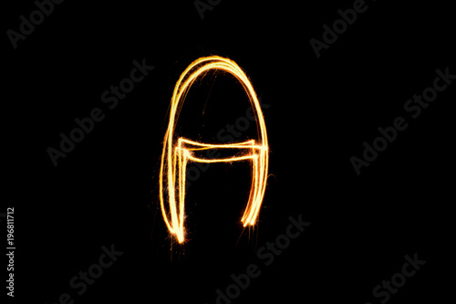Light painting alphabet A  on black back ground . © Yellow Boat