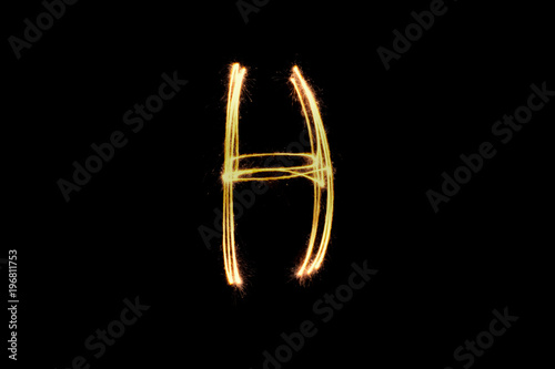 Light painting alphabet h on black back ground . © Yellow Boat