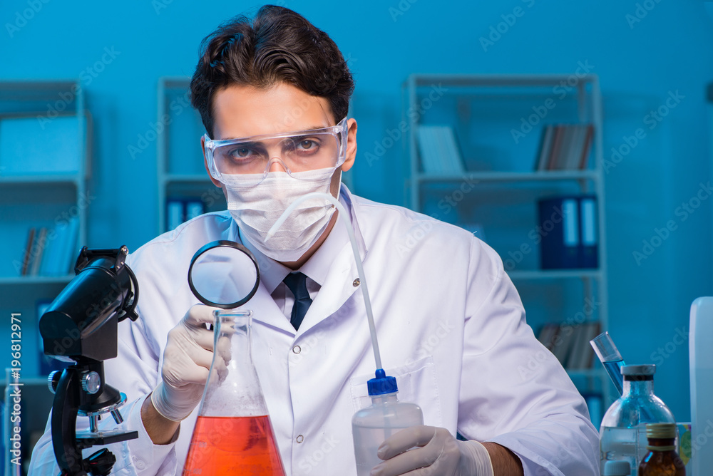 Chemistry assistant working in the chemical lab Chemistry assistant working in the chemical lab