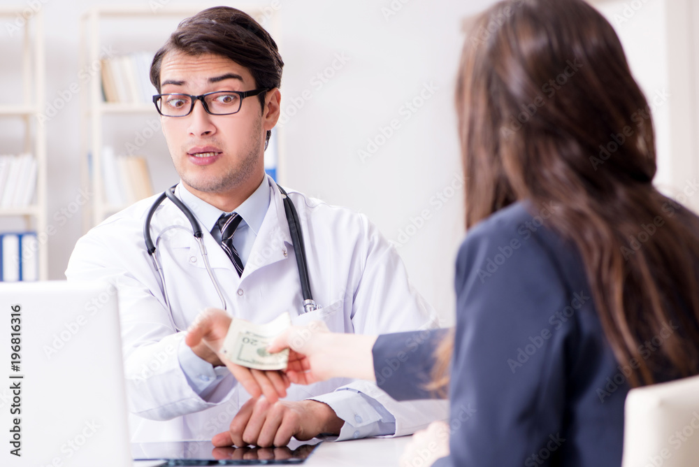Doctor in corruption concept with being offered bribe Doctor in corruption concept with being offered bribe