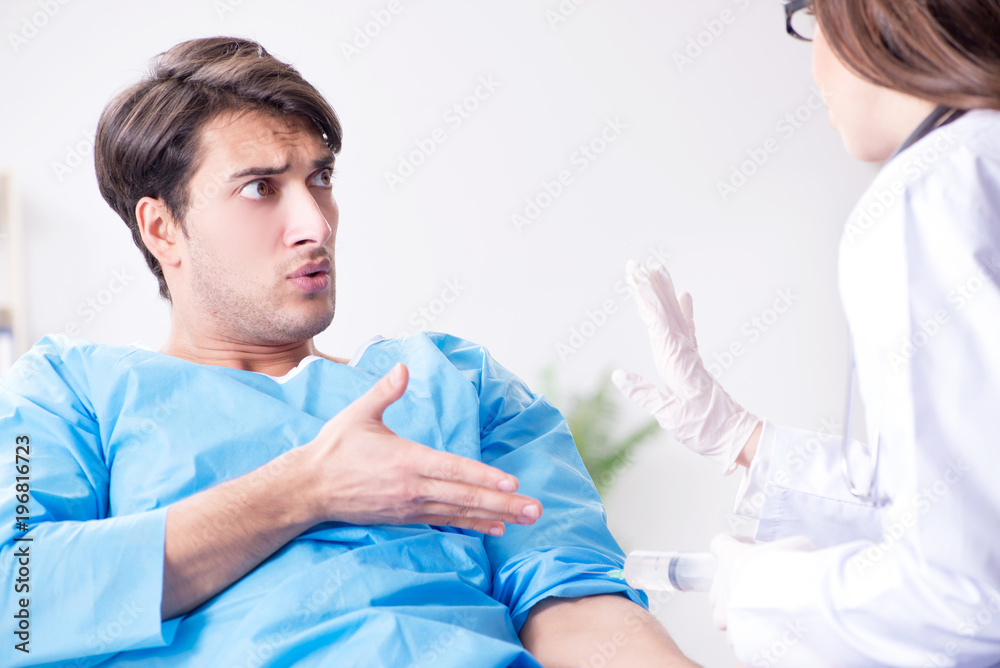 Scared patient man getting ready for flu shot Scared patient man getting ready for flu shot