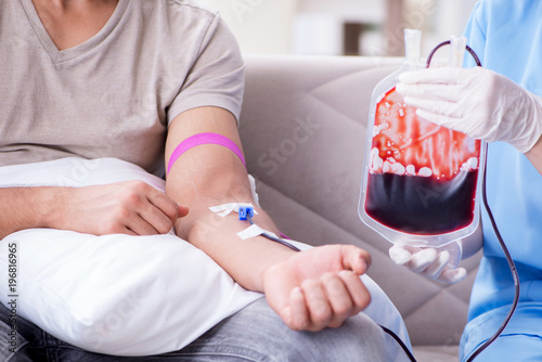 Patient getting blood transfusion in hospital clinic