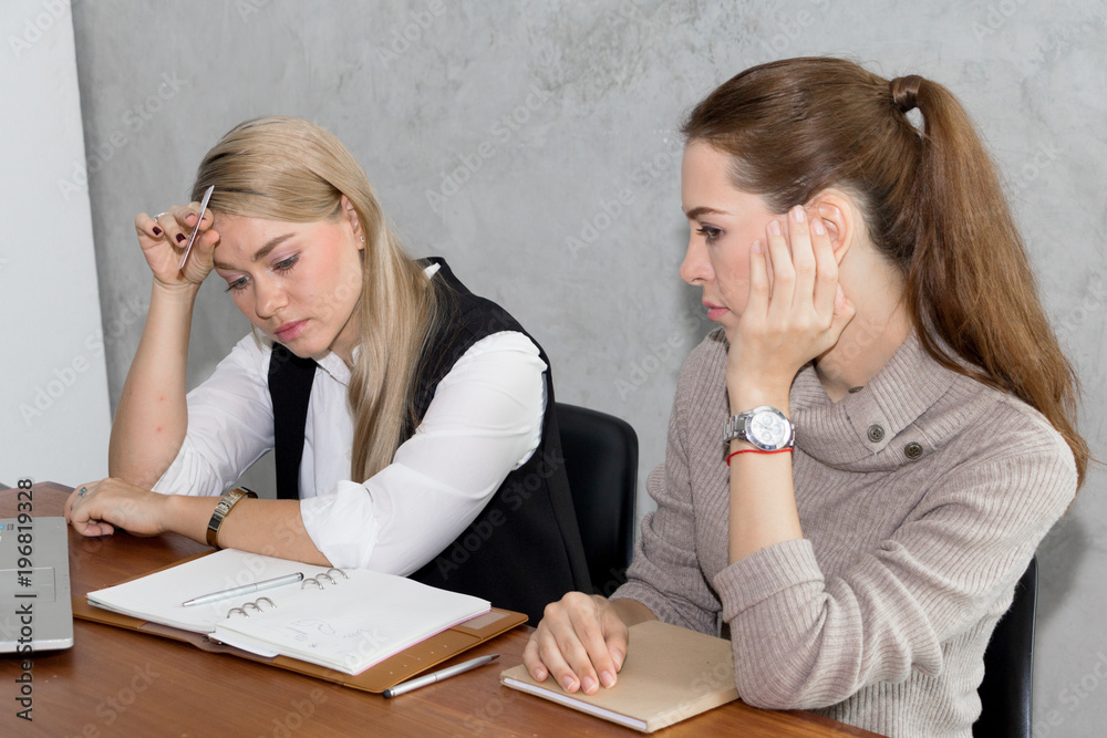 Two women are studying and teaching Two women are studying and teaching