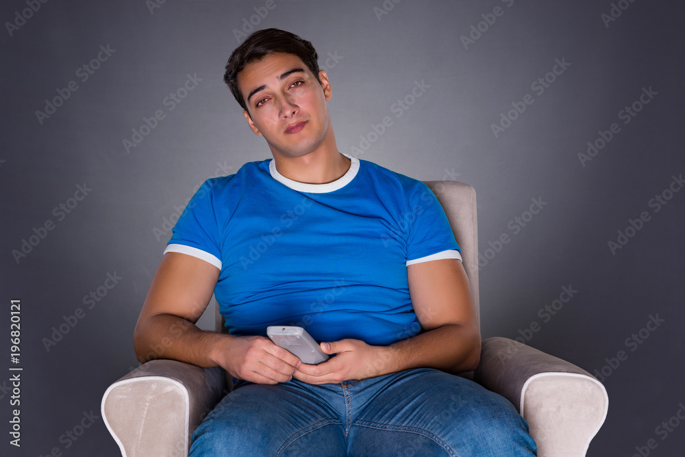 Man watching sports on gray background Man watching sports on gray background