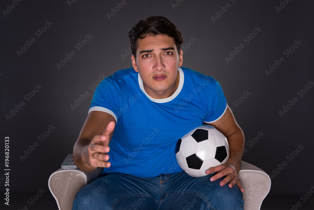 Man watching sports on gray background Man watching sports on gray background