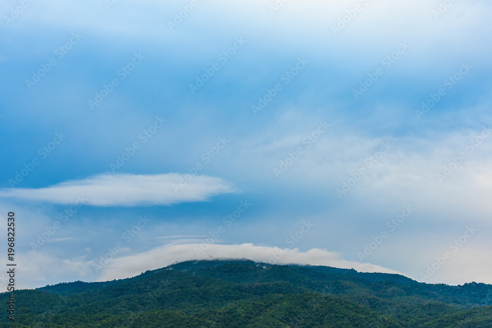   blue sky and mountain in background.