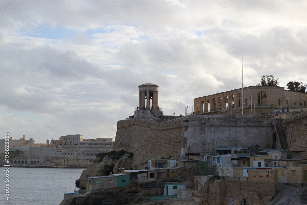 View to Siege Bell War Memorial and fort St Angelo, Valletta, Malta