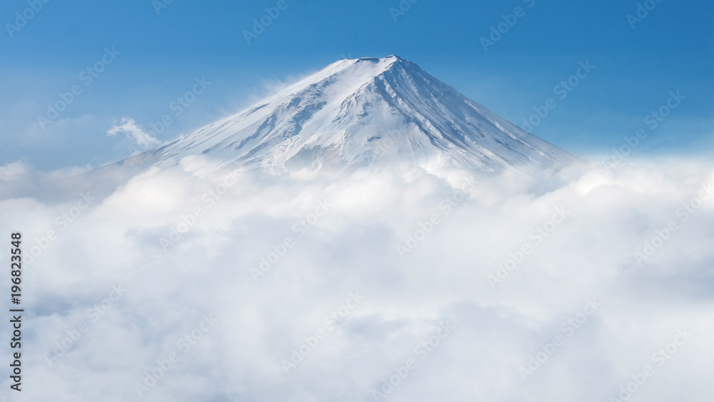 closeup of mount Fuji covered by snow and mist in the morning, Japan