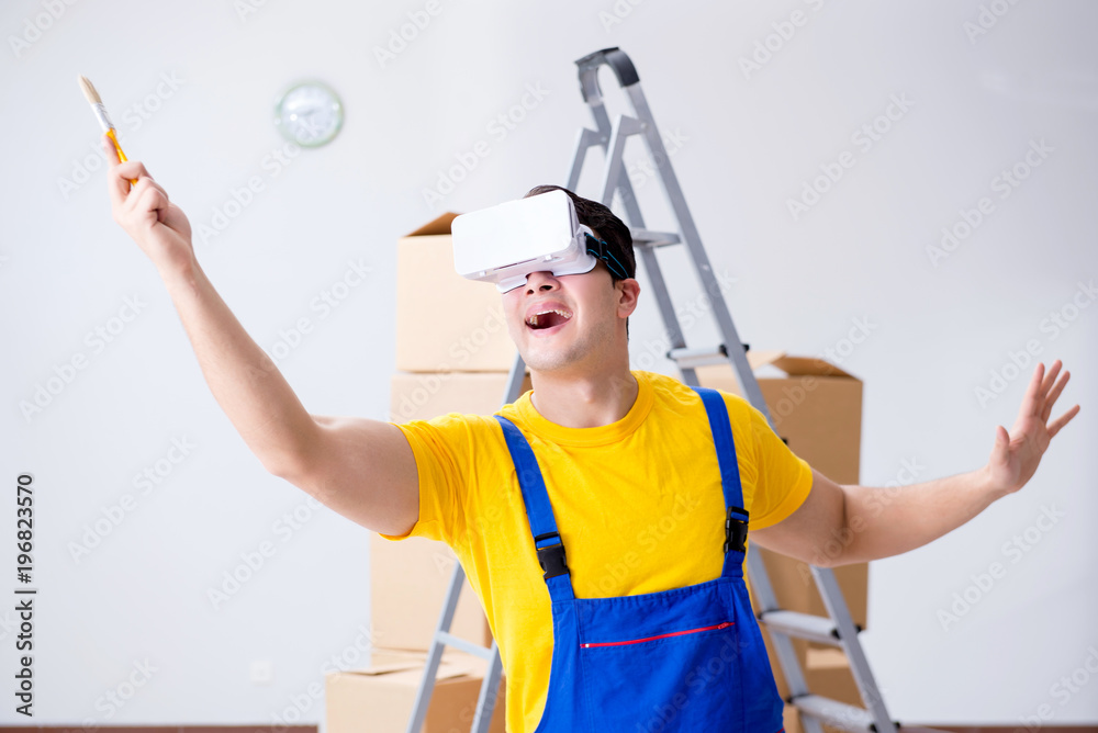 Painter contractor working with virtual reality goggles Painter contractor working with virtual reality goggles