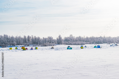 winter fishing on the river in tents