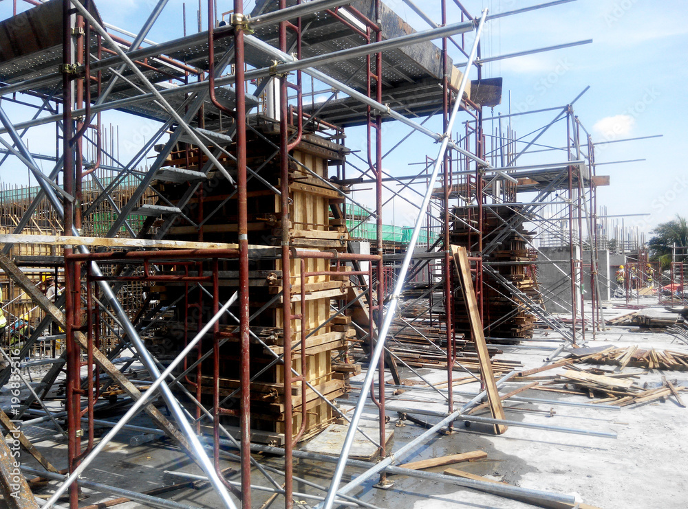 Column timber form work and reinforcement bar at the construction site in Malacca, Malaysia. The structure supported by temporary wood support Column timber form work and reinforcement bar at the construction site in Malacca, Malaysia. The structure supported by temporary wood support