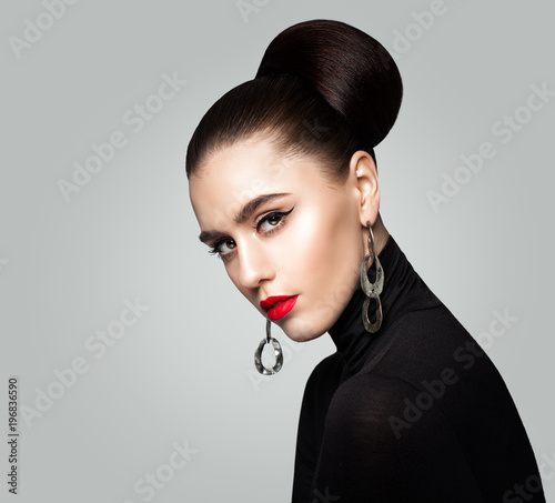 Perfect Young Woman Fashion Model. Girl with Hair Updo and Red Lips Makeup