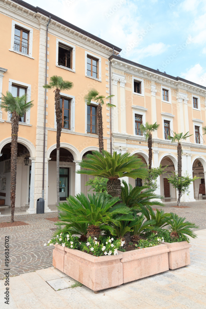 Townhall and palm trees in Salo at Lake Garda, Italy