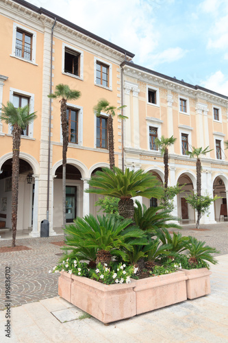 Fototapeta Naklejka Na Ścianę i Meble -  Townhall and palm trees in Salo at Lake Garda, Italy
