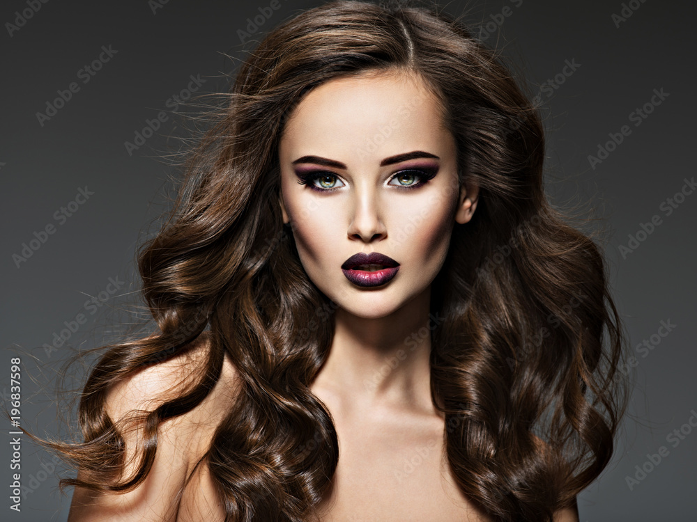 Fototapeta premium Beautiful young woman with long hair.