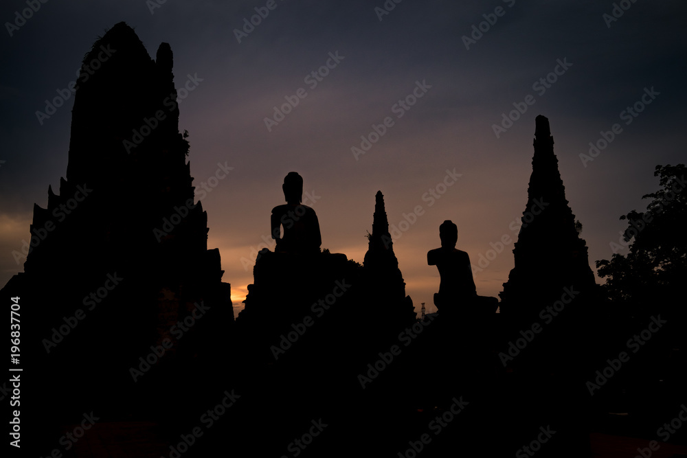 Buddha statue silhouettes at sunset in a temple, Ayutthaya