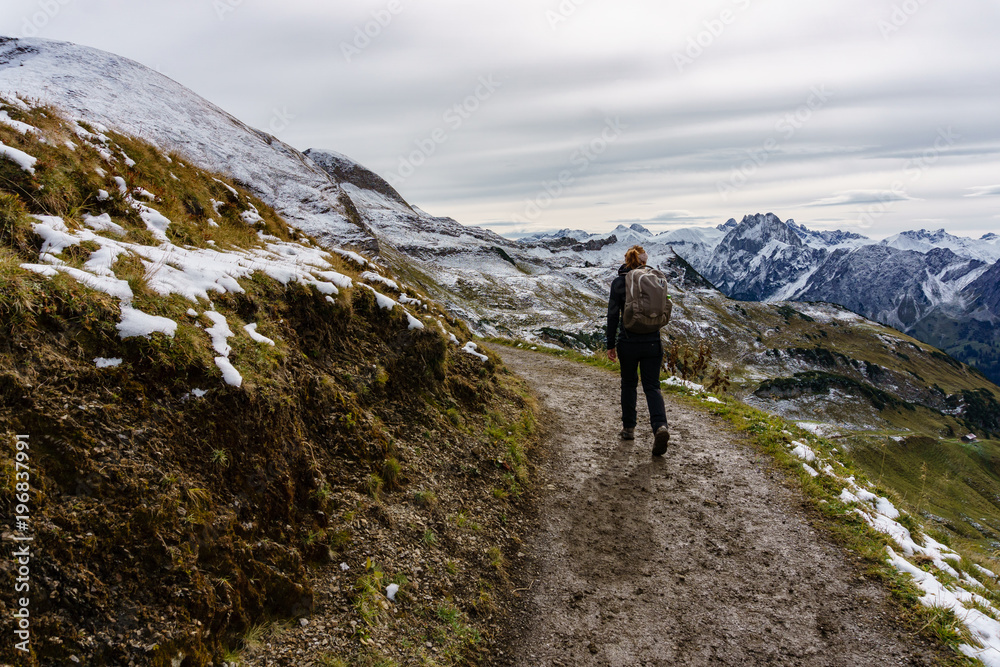 Young woman hiking in Alps
