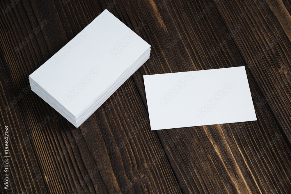 Blank business cards on wooden working table with copy space for add text ID. and logo, business company concept. Blank business cards on wooden working table with copy space for add text ID. and logo, business company concept.