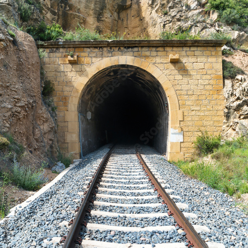 Old train tunnel with railway in a mountain