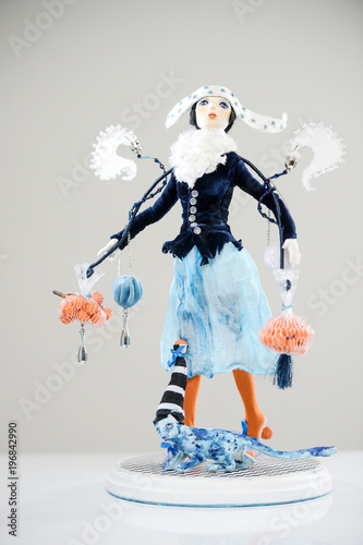 фотографія Porcelain brunette girl winter orange blue cat