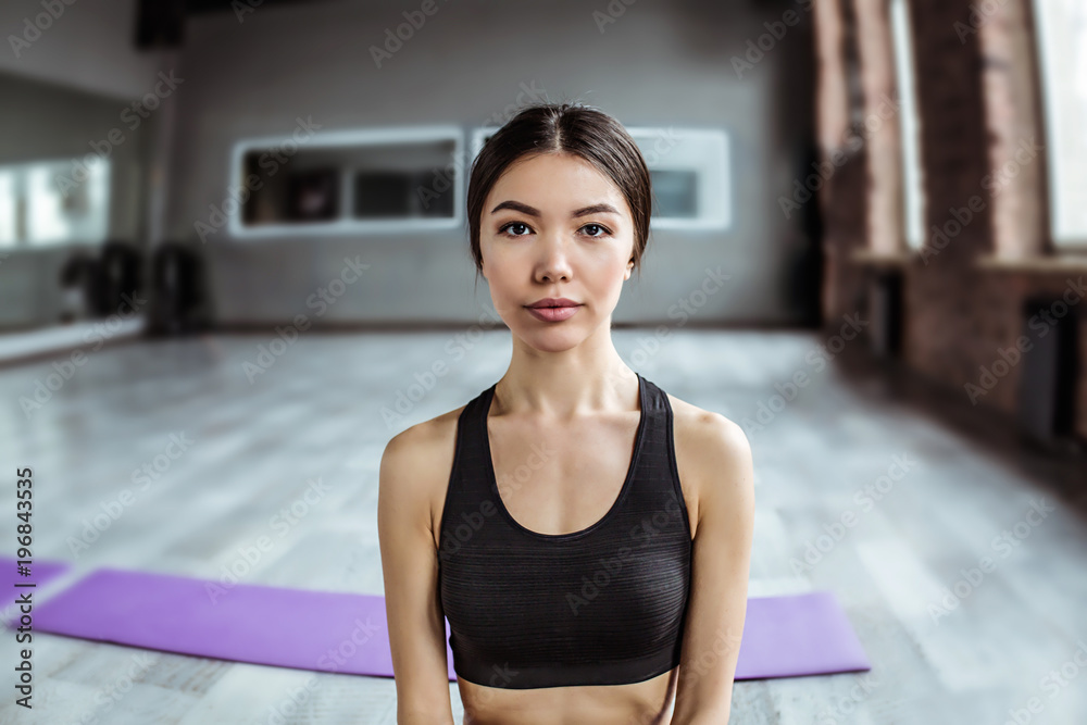 Beauty and relaxation. Young beautiful asian woman while practicing yoga at the gym Beauty and relaxation. Young beautiful asian woman while practicing yoga at the gym