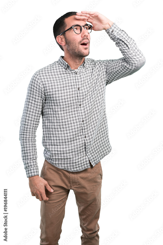 Astonished young man with a gesture of search Astonished young man with a gesture of search