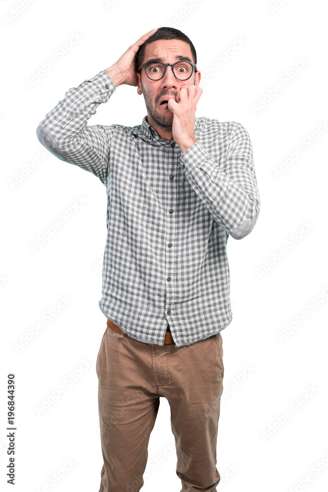 Nervous young man with a gesture of anxiety Nervous young man with a gesture of anxiety