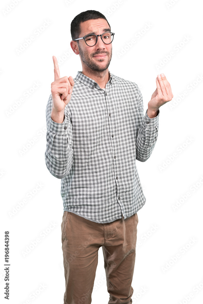 Puzzled young man posing