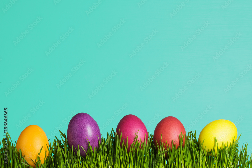 colored Easter eggs on the grass