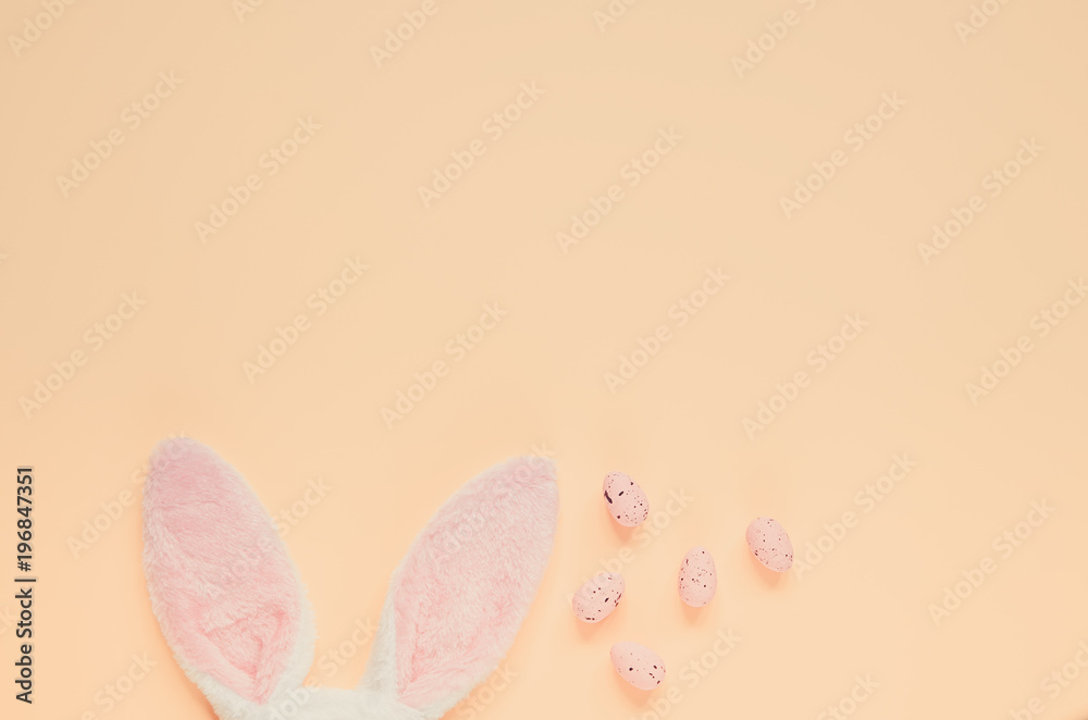 Easter holiday background with bunny ears and easter eggs