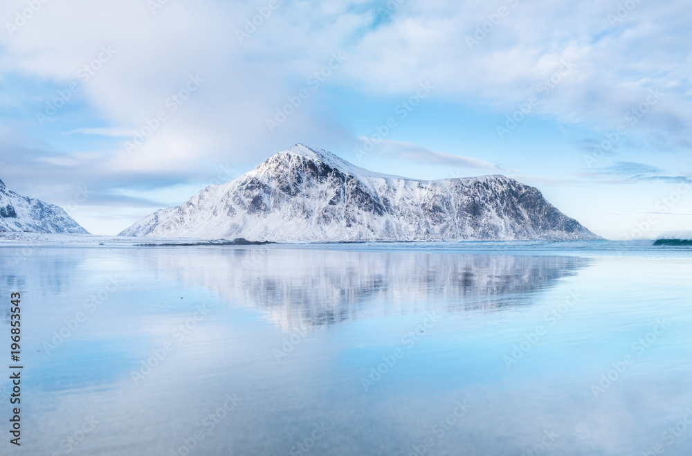 Mountain ridge and reflection on the seashore. Natural landscape in the Norway Mountain ridge and reflection on the seashore. Natural landscape in the Norway