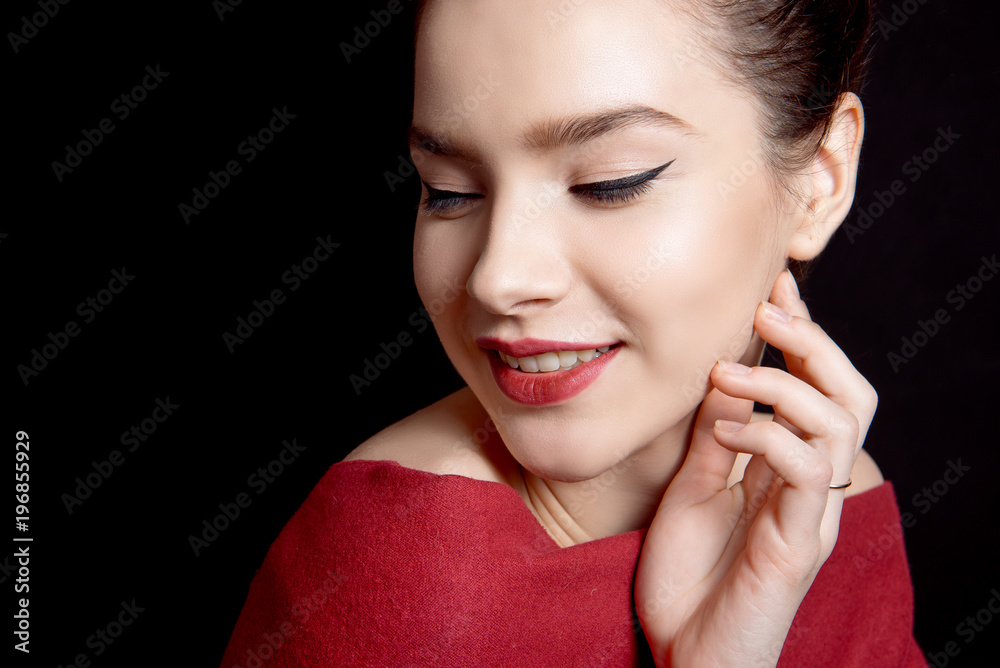 Close up woman portrait with bare shoulders on black background. Close up woman portrait with bare shoulders on black background.