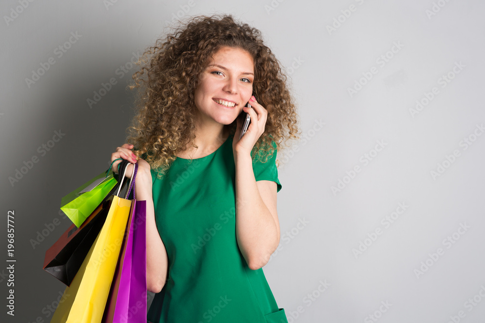 woman with shopping bags in hands