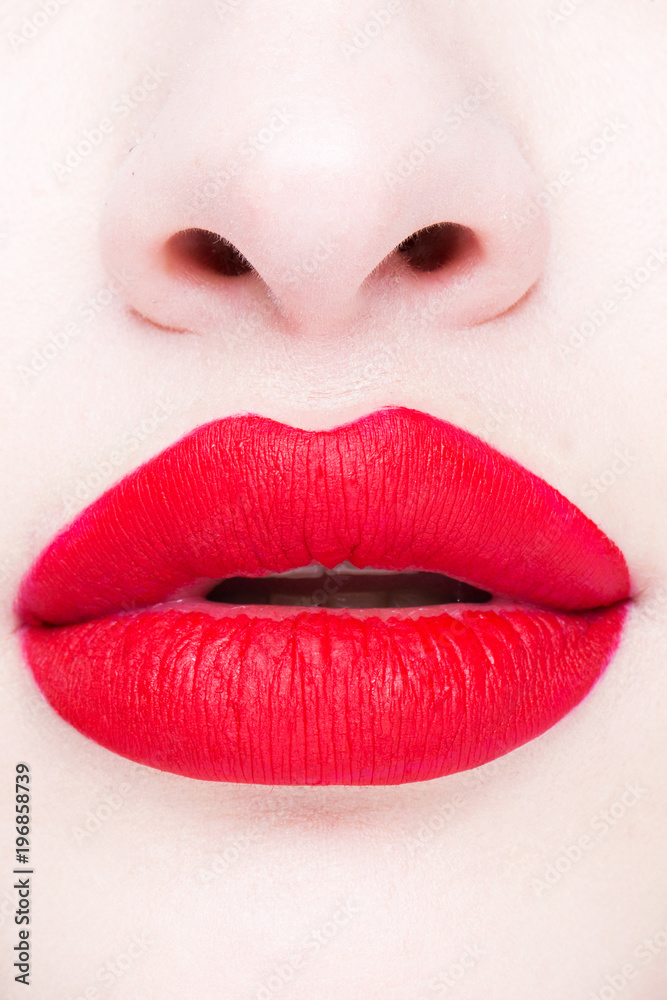 Beautiful plump sexy lips with red lipstick. Close-up. Beautiful plump sexy lips with red lipstick. Close-up.