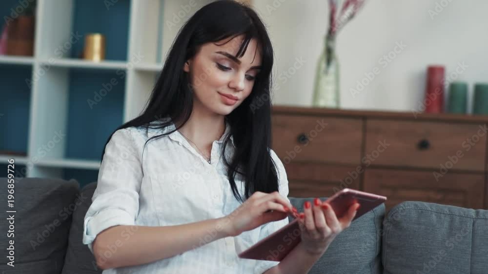 Young pregnant woman using tablet computer smiling sit on sofa touches the abdomen happy internet technology tablet electronics pc mother pregnancy touch enjoy motherhood relax home portrait close up Young pregnant woman using tablet computer smiling sit on sofa touches the abdomen happy internet technology tablet electronics pc mother pregnancy touch enjoy motherhood relax home portrait close up