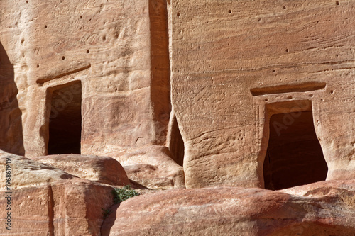 Close-up of two empty burial chambers and tombs in Petra, Jordan