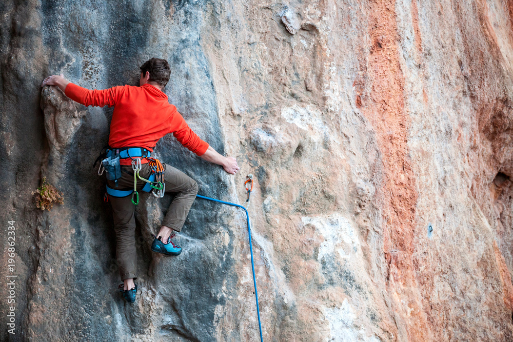 A man climbs the rock. A man climbs the rock.