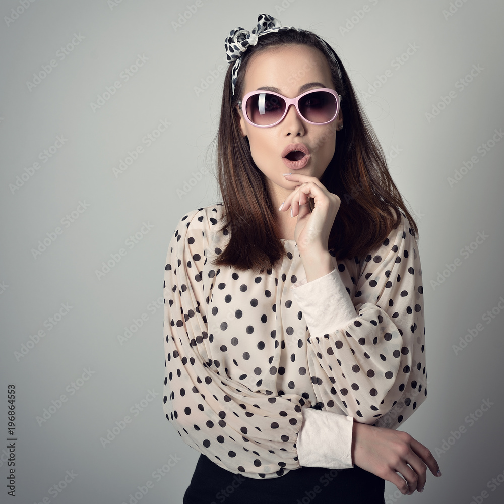 Fototapeta premium Pinup girl. Vintage portrait of young attractive woman in retro pin-up style.