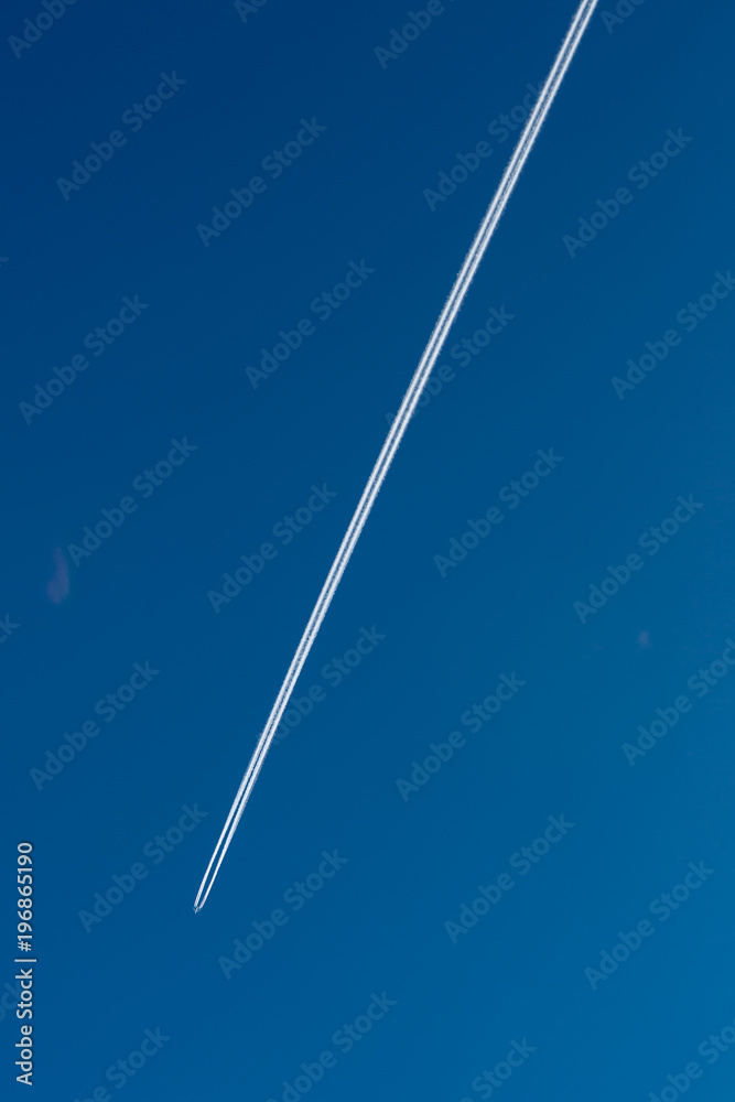 Trace of the flying jet plane in the sky Trace of the flying jet plane in the sky