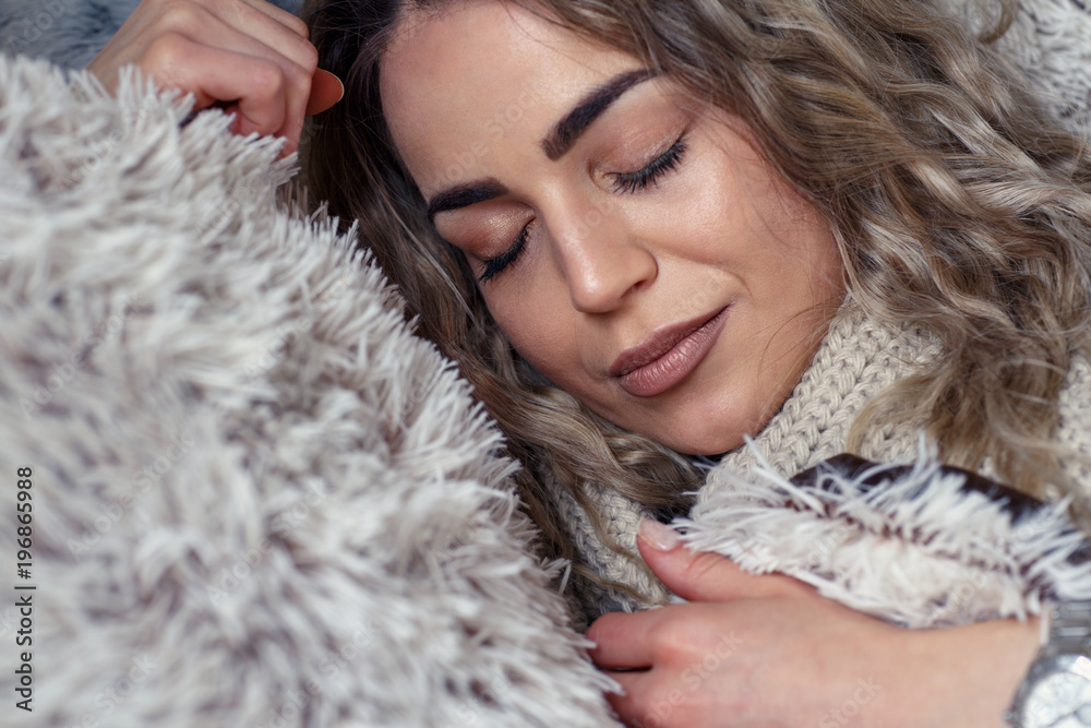 Beautiful woman sleeping in a comfortable bed at home. Beautiful woman sleeping in a comfortable bed at home.